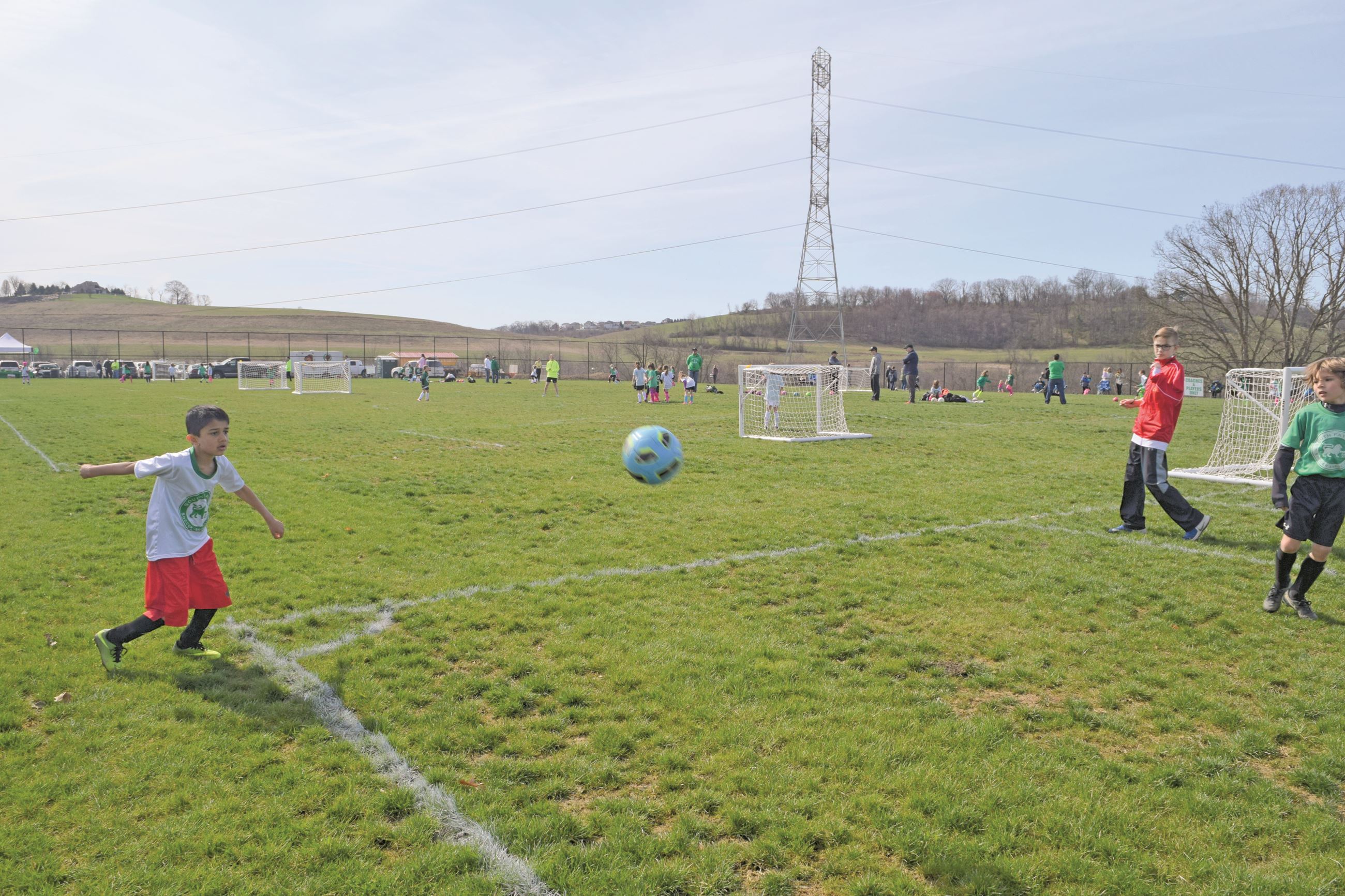 broad view of fields with boy playing DSC_0878