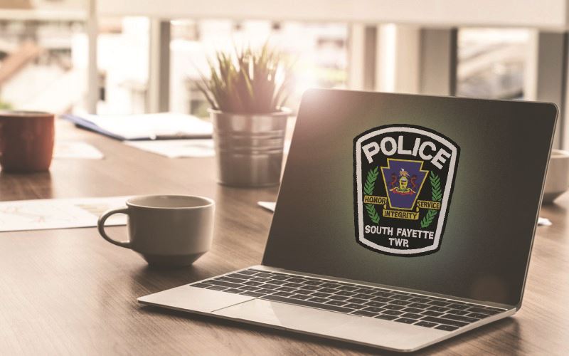 laptop with polie patch image and coffee