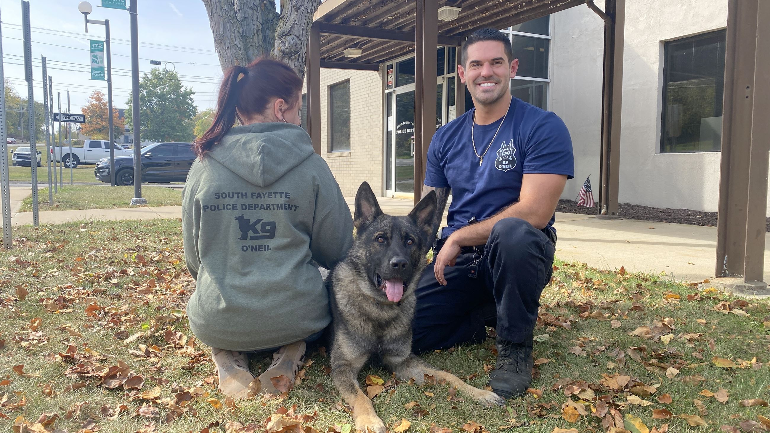 People wearing K9 shirts with dog O'Neil