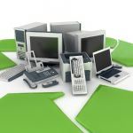 Electronics piled in middle of green recycling arrow symbols